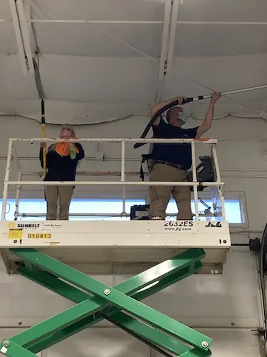 Rafters and Ceiling Cleaning Industrial cleaning services in action, cleaning rafters.
